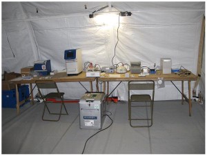 Here is a photograph of the mobile molecular diagnostics, microbiology laboratory developed by pathologists at PathWest Laboratory Medicine in Western Australia. Its developers call it the “mobile medical laboratory in a suitcase.” In the field, one primary goal during the demonstration phase is to identify mosquito-borne illnesses. (Photo copyright PLOS.org.)