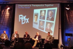 This panel took up the subject “Diagnostics and Therapeutics Together: The New World!” yesterday at the Personalized Medicine World Conference that took place in Mountain View, California. From Left: Walter Koch, Ph.D., Roche Molecular Systems; Pat Groody, Ph.D., Abbott Diagnostics; David Parkinson, Nodality; Ted Snelgrove, Crescendo Biosciences; and, Moderator Scott Patterson, Ph.D., Amgen.