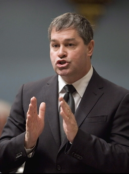 Yves Bolduc, Quebec’s Minister of Health, discusses problems with inaccurate pathology lab tests for breast cancer. (Photo copyright The Canadian Press)