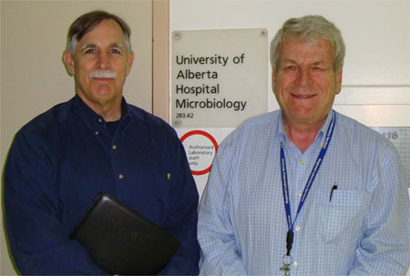 In Edmonton, at the University of Alberta Department of Pathology and Clinical Laboratory Services (from left): Robert L. Michel, Editor of Dark Daily; and Dr. Robert Rennie, Ph.D., Clinical Department Head.
