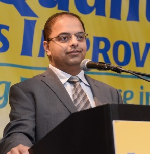 Pathologist Gaurav Sharma, M.D. (pictured above) explained how clinical laboratory and anatomic pathology services have been integrated in recent years at Henry Ford Health System in Detroit, Michigan. He described the use of daily management within the laboratory and how it helps lab staff identify recurring sources of errors and reduce or eliminate them. Sharma is Director of the, Regional Medical Laboratory and Associate Medical Director, Core Laboratory, Quality Systems and Regulatory Affairs. (Photo by Duane Stork, copyright The Dark Report.)